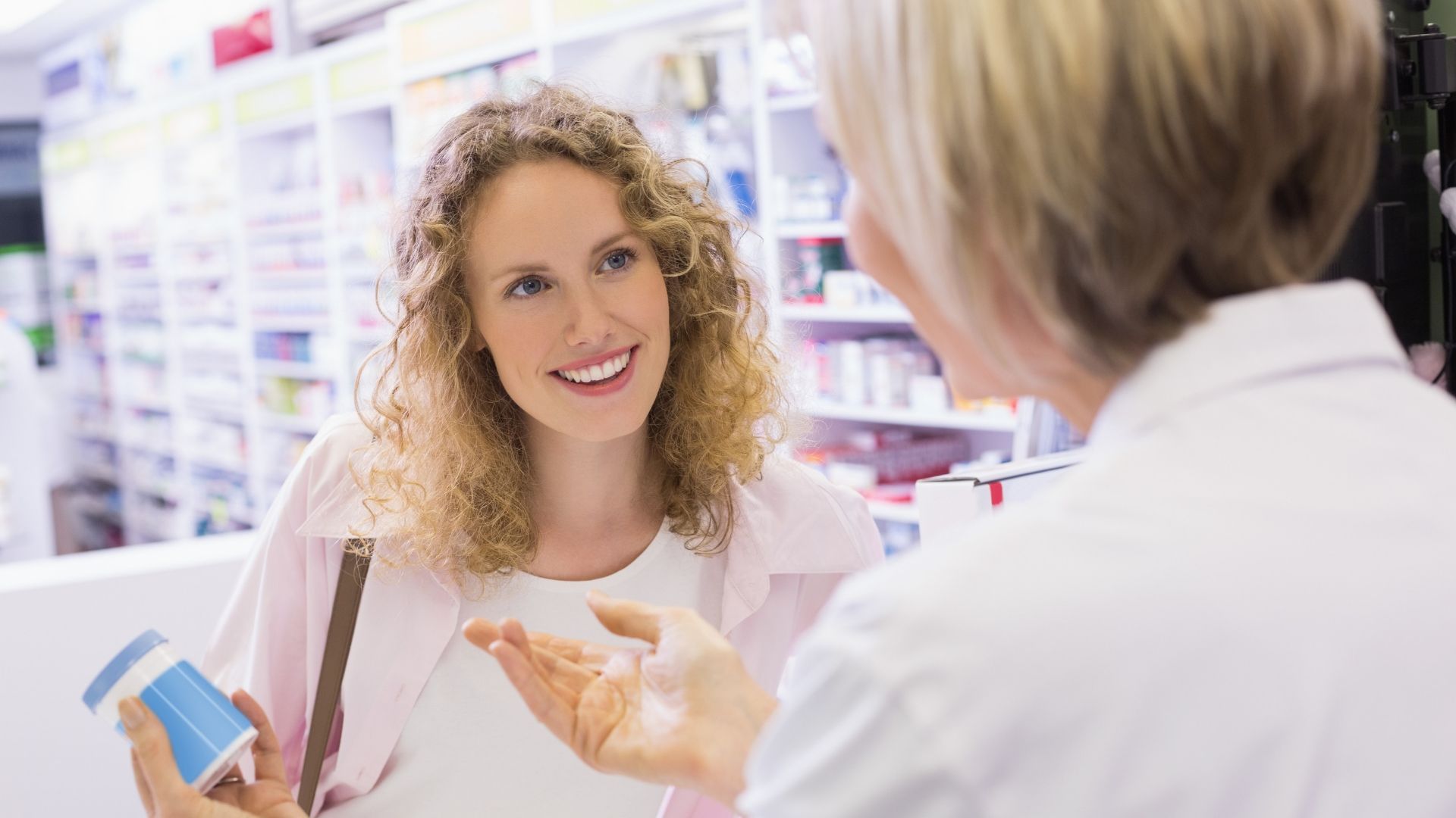 Pharmacist talking to patient