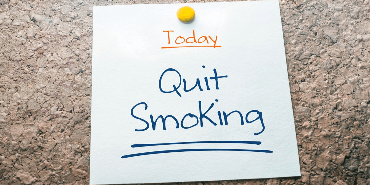 Paper with "Today: Quit Smoking" written